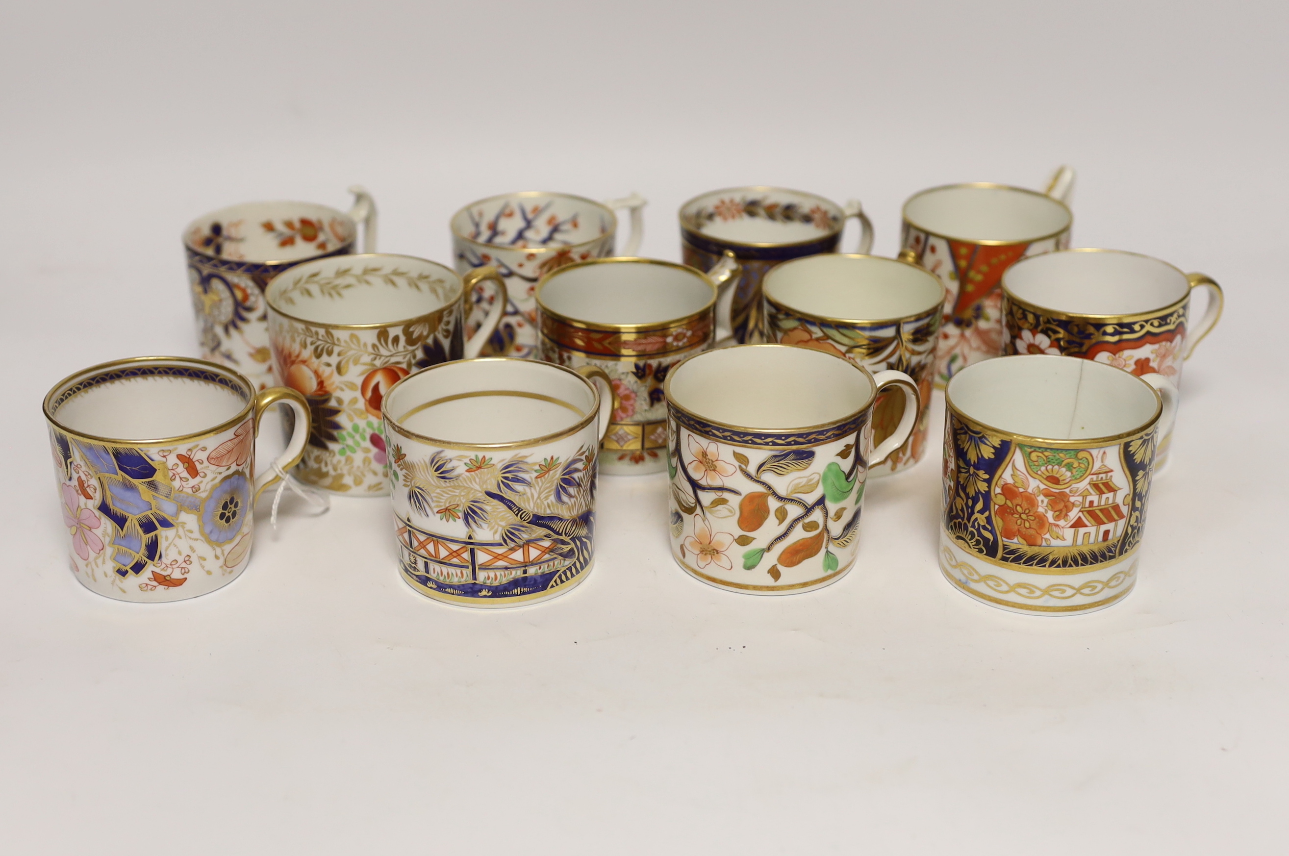 Twelve 1800-1820 English Imari patterned coffee cans